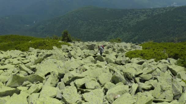 Man Walks Mountain Slope Covered Giant Stones Solo Tourism Hard — Stock Video