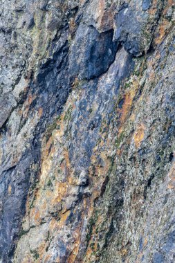 Colorfull stone wall containing minerals.