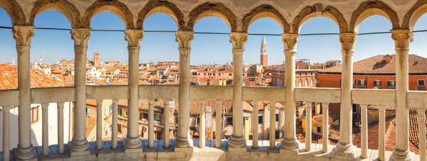 VENICE, ITALY - MARCH 4, 2023: Historic city centre with St. Mark's Campanile, panoramic view from staircase of The Palazzo Contarini del Bovolo.