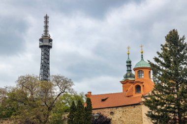 Petrin Lookout Tower next to Church of Saint Lawrence in Prague, Czech Republic, Europe. clipart