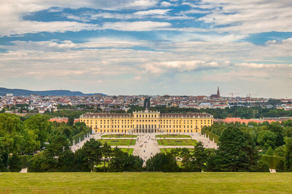 VIENNA, AUSTRIA - AUGUST 29, 2013: The Schonbrunn Palace with garden and cityscape in background.