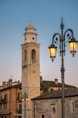 Church in Lazise town on shore of Lake Garda in the early evening, Italy, Europe. clipart