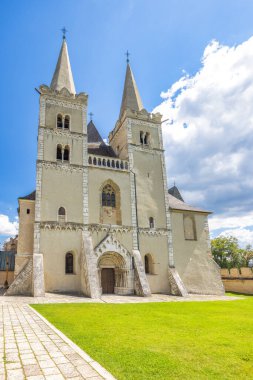 St. Martin's Cathedral in Spisska Kapitula town, region of Spis in Slovakia, Europe. Historical church with twin towers, showcasing detailed architectural features and serene surroundings.