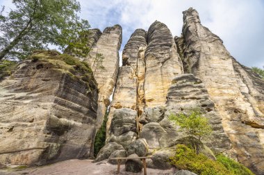 Adrspach-Teplice Rocks, sandstone formations in Hradec Kralove Region in Czech Republic, Europe. Majestic rock formations rise dramatically towards the sky, showcasing nature's impressive artistry.