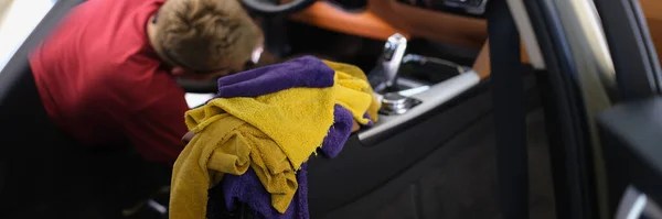 Master does complete dry cleaning of interior of car. Presale car interior cleaning concept