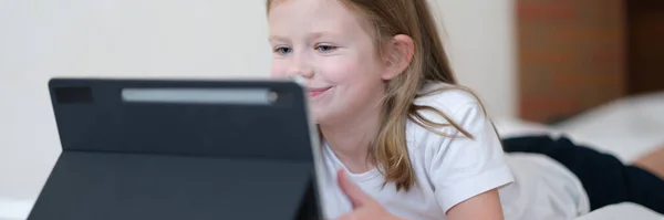 Smiling Little Girl Looks Tablet Baby Mobile Apps Concept — Foto de Stock