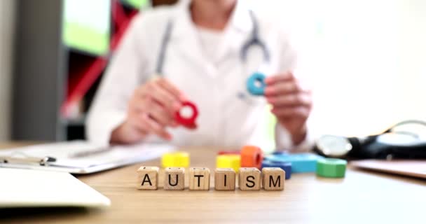Doctor Holds Hands Multicolored Cubes Text Autism Development Children Autism — Stock Video