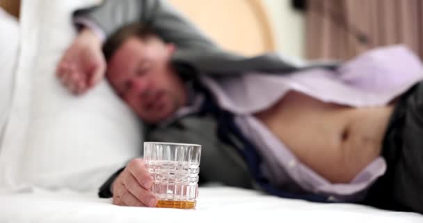 Sleeping Businessman Sleeps Bed Hotel Room Holds Alcohol Alcohol Abuse — Stock Video