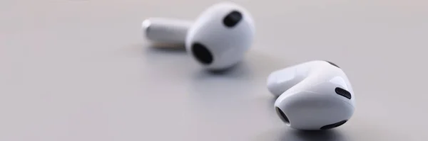 Close New White Wireless Earphones Grey Background Listen Music Connect — Stockfoto