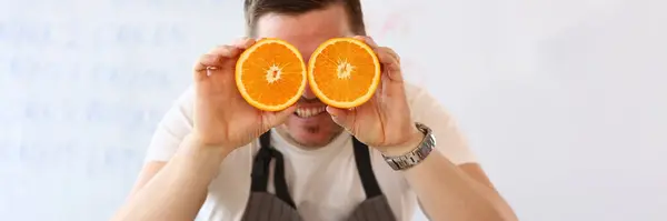 Portrait Man Holding Cut Oranges Eye Level Instead Glasses Healthy — 스톡 사진