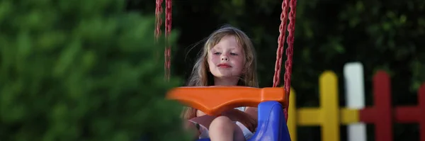Portrait Little Smiling Girl Riding Swing Playground Outdoors Swing Ride — Stock fotografie