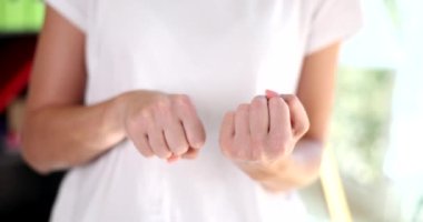 Closeup of hands showing middle finger in fuck you gesture. Negative gesture and anger
