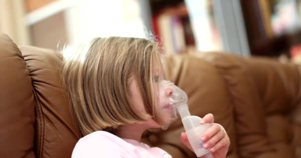 Little Girl Home Couch Breathes Inhaler Close Respiratory Diseases Asthma — Stock Video
