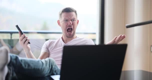 Man Sits Table Yells Laptop Monitor Emotions Bad News Financial — Stock Video