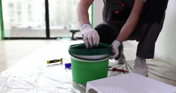 Master Repairman Opening Plastic Can White Paint Closeup Movie Slow — Stock Video