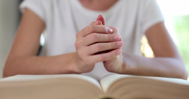 Woman Prays Hands Clasped Bible Faith Hope Crisis Christian Life — Stock Video