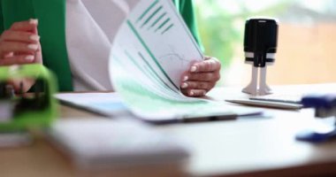 Financial report boss puts seal on official document. Business performance statistics
