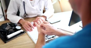 Dermatologist examines skin of hand with itching of sick patient. Examination and diagnosis of skin diseases allergies psoriasis, eczema and dermatitis