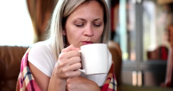 Young Sick Woman Sits Home Couch Wrapped Blanket Drinks Hot — Stock videók