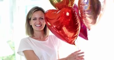 Attractive beautiful happy woman with balloons. Emotions of celebration and surprise