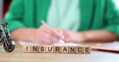 Agent or client fills out auto or motorcycle insurance form. Car insurance deal and warranty