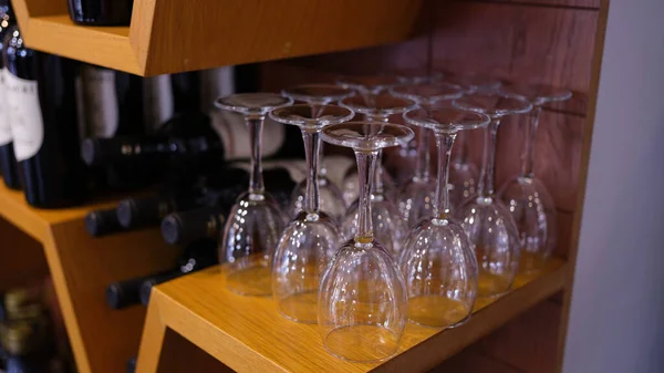 Empty glasses on table in a wine cellar for tasting drink. Wine cabinet with elite wine concept