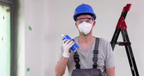 Male Builder House Painter Shakes Colorful Aerosol Can Paints Varnishes — Vídeo de Stock