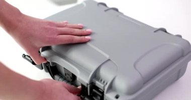 Female hands open business case with many dollars. Unexpected wins wealth finance or bribe and crime