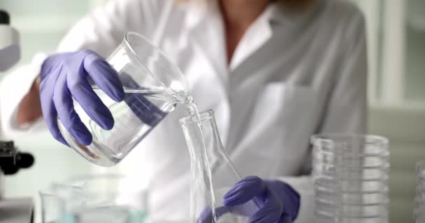 Scientist Chemist Pours Water Transparent Bottle Flask Laboratory Checking Concept — Stock videók