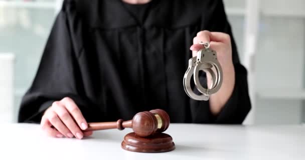 Judge Holds Handcuffs Knocks Court Gavel Offender Justice Verdict Court — Stockvideo