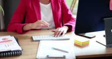 Businesswoman in pink suit waving her hand at computer screen closeup 4k movie slow motion. Business conference concept 