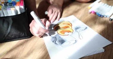 Artist hand drawing pancakes on piece of paper using markers closeup 4k movie slow motion. Hobby drawing concept 