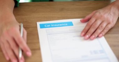 Agency giving client document for car insurance to sign closeup 4k movie slow motion. Property security concept 