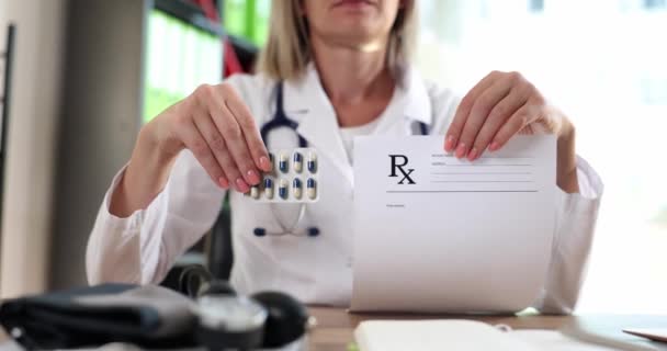 Doctor Holding Form Prescription Blister Medicines Clinic Closeup Movie Slow — Video