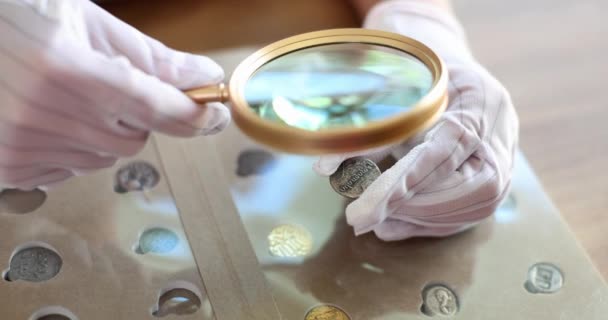 Numismatist White Gloves Looking Old Coin Magnifying Glass Closeup Movie — Stockvideo