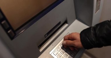 Man hand picking up dollar bills from ATM closeup 4k movie slow motion. Transfer money concept 