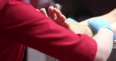Podiatrist making foot massage of female patient in clinic closeup 4k movie slow motion. Quality professional pedicure concept 