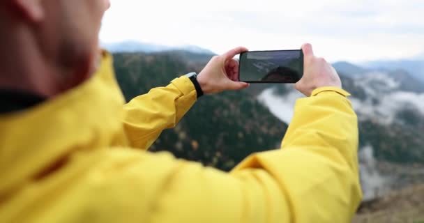 Man Photographing Beautiful Mountains Mobile Phone Camera Closeup Movie Slow — Stockvideo