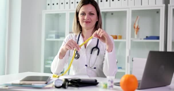 Doctor Nutritionist Holding Centimeter Tape His Hands Measure Patient Waist — Videoclip de stoc