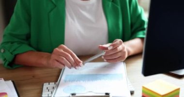 Businesswoman showing ok approved gesture at workplace. Online communication consultant service recommendation