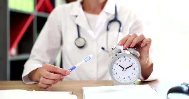 Doctor Dentist Holds Toothbrush Alarm Clock Hands Time Brush Your — Vídeo de Stock