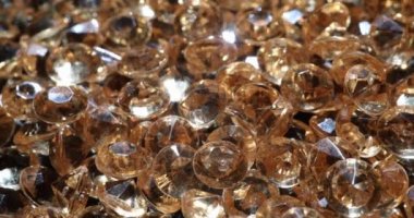 Yellow shiny diamonds and gems. Examination of quality of jewelry and diamonds concept