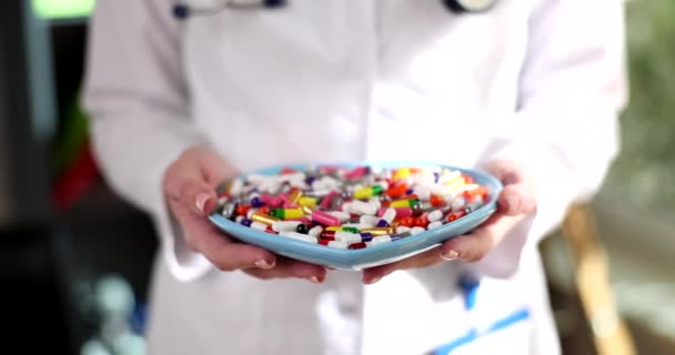 Doctor Holds Plate Different Medical Pills Consequences Uncontrolled Use Drugs — Vídeo de stock