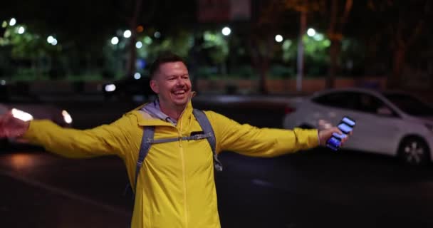 Man Emotionally Joyfully Jumps Phone His Hand Meets Friends Street — Stockvideo