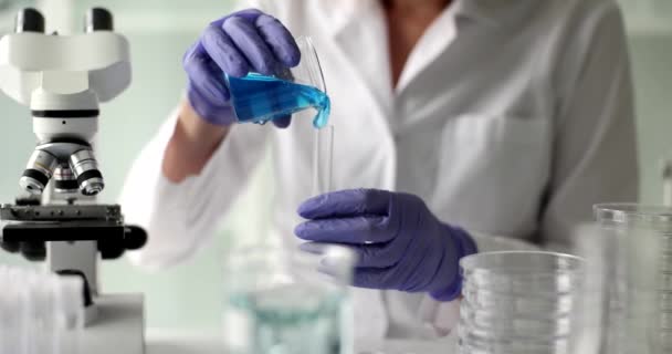 Scientist Analyzes Test Tube Using Blue Liquid Chemical Gel Substance — Video Stock
