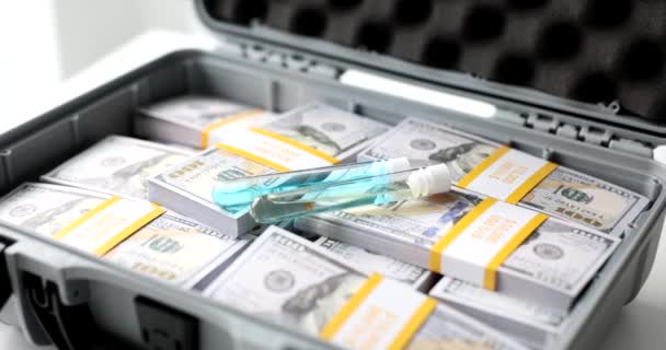Test Tubes Blue Liquid Vaccine Poison Suitcase Dollars Selling Illegal — Vídeo de stock