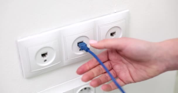 Hand Turns Blue Wifi Network Cable Wall Socket Internet Disconnection — Stock Video