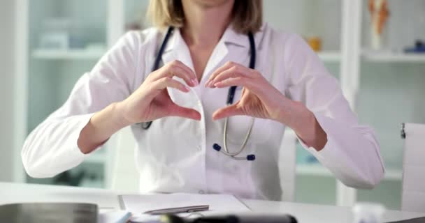 Doctor Cardiologist Shows Heart Gesture Closeup Symbol Health Care Medical — Vídeo de stock
