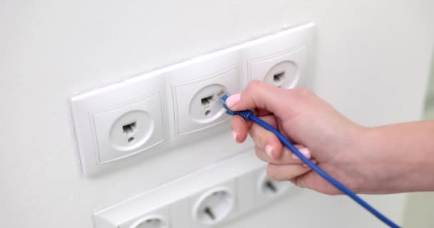 Hand Connects Internet Cable Extension Cord Electrical Outlet Wall Concept — Stock Video