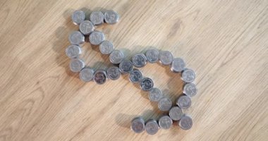 Dollar sign stacks of coins and world economy. Inflation and financial income growth